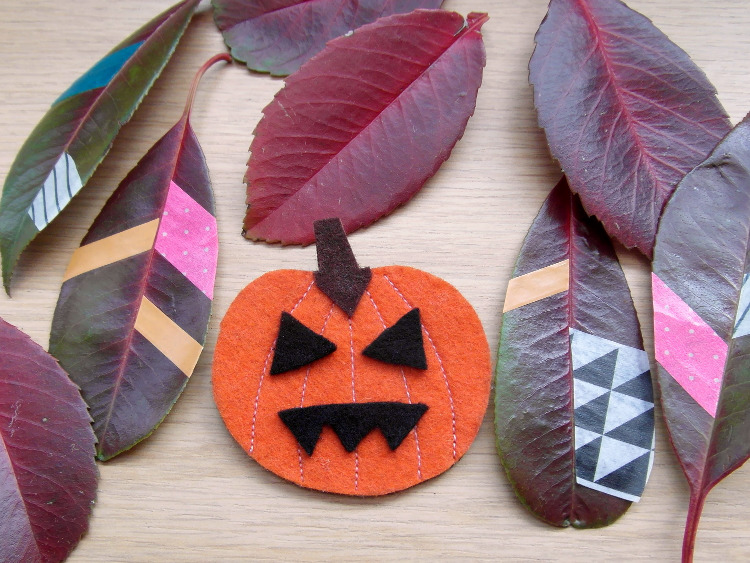 Decorated leaves and felt pumpkin badge
