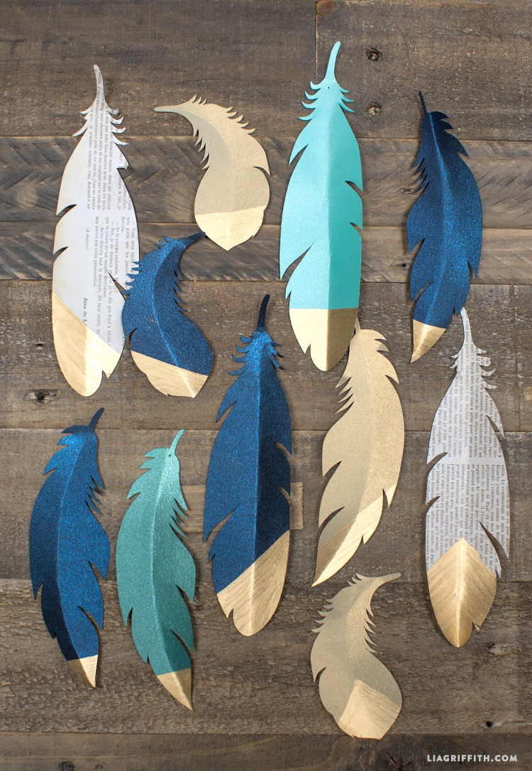 Gold tipped paper feathers make great decorations for gifts or garlands