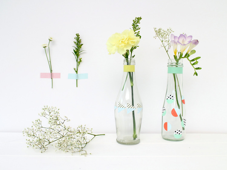 Bottles decorated with DIY washi tape stickers