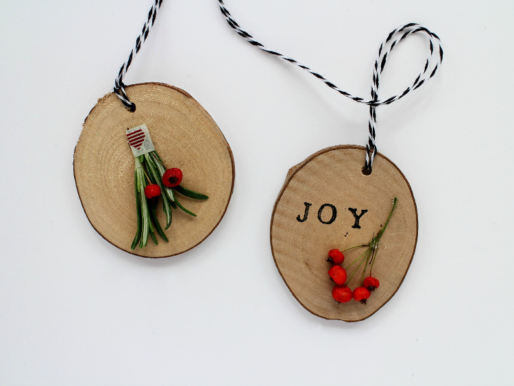 Wooden disc decorations with berries and foliage