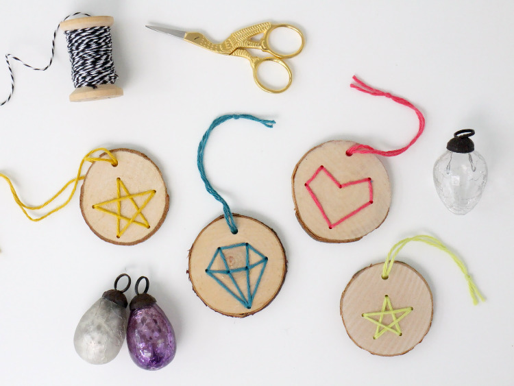Stitched wooden disc decorations