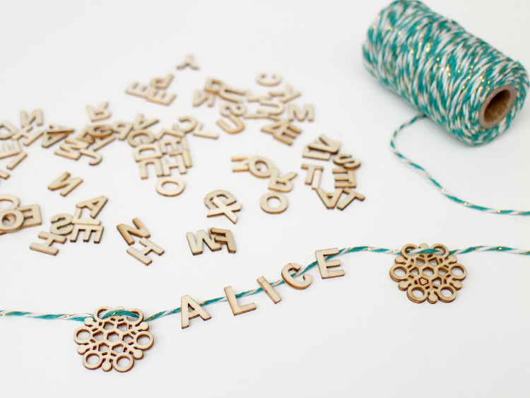 Sort your wooden letters and glue them to the twine