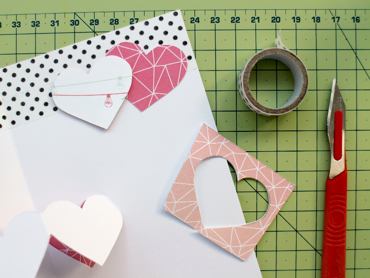Decorating the card with washi tape and scrapbook paper